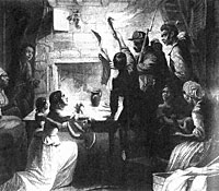 A soldier reads the Emancipation Proclamation to a Slave Family in their cabin
